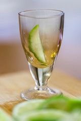 stack with lime slice on wooden table, close up, blurry background