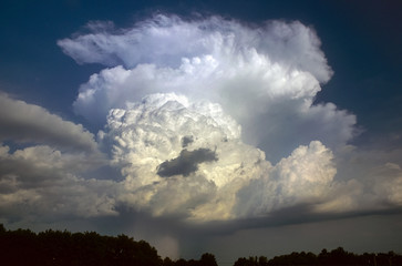 Hail storm on the border of Oklahoma and Arkansas. Beautiful convective tower, anvil and hail streaks.