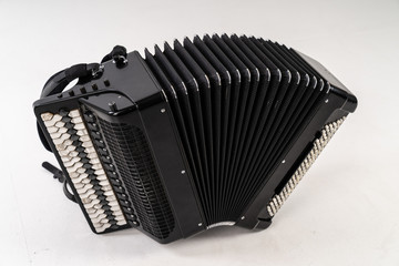Black accordion on pure white background