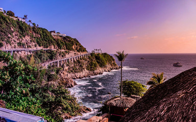 cliff on a pacific coast overlooking the ocean horizon