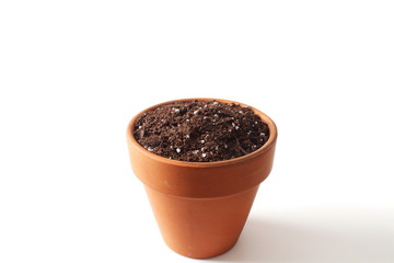 pot filled with organic potting soil on white  background