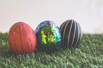 Easter eggs on green background