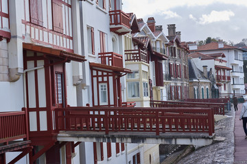 A view of the French coast of San Juan de Luz with typical colored houses.