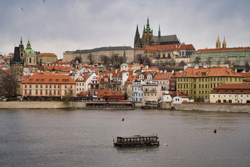Obraz premium Prague, Czech Republic - March 04, 2019: Old Town - the historic district of Prague in the Prague 1 area on the right bank of the Vltava. Boat
