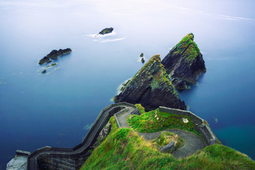 Staircase leading to the Dunquin Pier in Ireland - obrazy, fototapety, plakaty