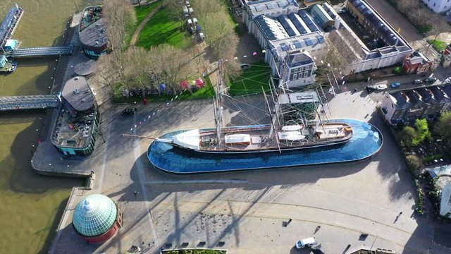 Aerial drone video of famous Cutty Sark the only tea clipper survived and used as a museum next to Greenwich pier in the heart of London, United Kingdom