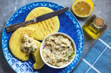 Meat stuffed pita bread and tzatziki dip.