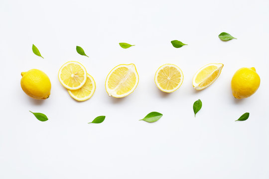 Lemon and slices with leaves isolated on white. © Bowonpat
