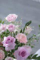 Bouquet of lilac roses and other flowers