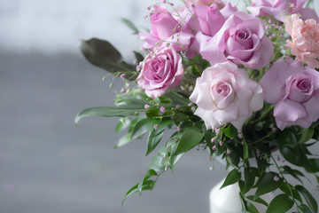 Bouquet of lilac roses and other flowers