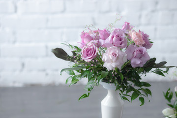 Bouquet of lilac roses and other flowers