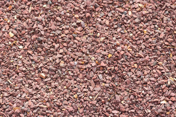 Red granite crumb, background, texture, red burgundy stone granules