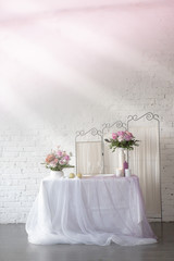 The decor of roses and baby's breath on a white brick wall background
