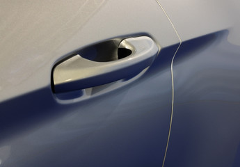 Silver door handle on the car as conceptual background with narrow focus