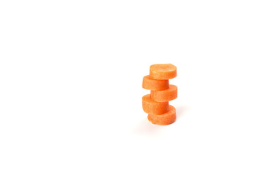 Carrot sliced into round slices isolated on white background.
