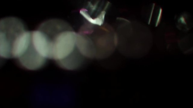 Multicolored glass background, polychrome colors bokeh. Slow motion footage.