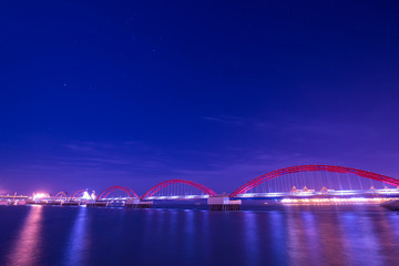 Fototapeta na wymiar The freighter dock on the sea bridge at night