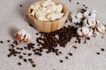 Top view spa and wellness setting with natural bath soap, cotton flowers and coffee beans for anticellulite massage for perfect healthy body and skin. Beauty luxury spa concept. Copyspace for text