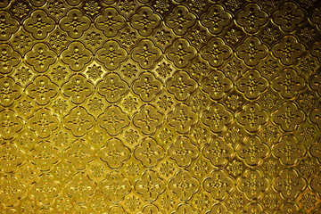 close up pattern of gold color throughout ancient glass