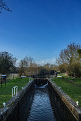 Fototapeta na wymiar Feakes Lock on the Stort and Lee Navigation or canal between Harlow and Sawbridgeworth in Hertfordshire.