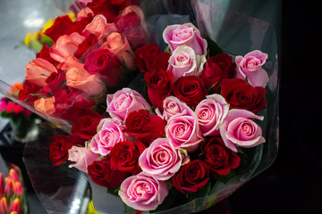 Several bouquets of roses for sale at the market