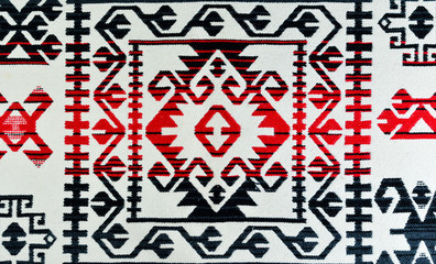 Romanian  hand-mademulti-colored   carpets with ethnic ornaments and  motifs