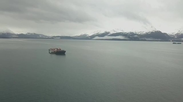 Tugboats and barges anchored up on Resurrection bay in Alaska 