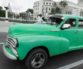 Cuba Havana street vintage green car closeup 