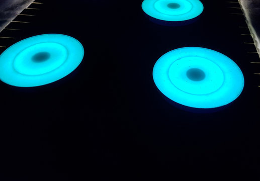 Luminous LED circles that illuminate when stepped on in different colors.