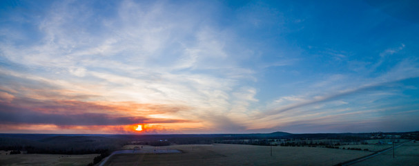 Aerial panorama of a sunset with smoke from a large brush fire