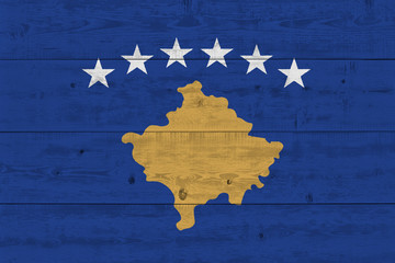 Kosovo flag painted on old wood plank