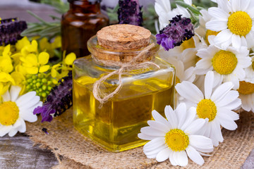 Mixed herbal oil. Essential oil various. Colorful flowers.