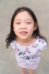 Braces on Teeth of Young Asian Kid.