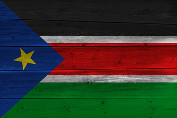 South Sudan flag painted on old wood plank