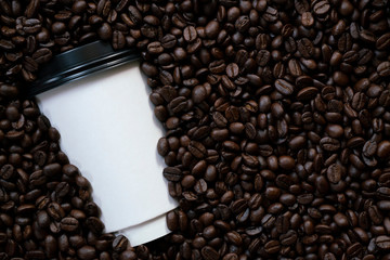 Paper cup of coffee with coffee beans, hot drink concept