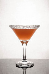  glass goblet on white background with  liquid splashing