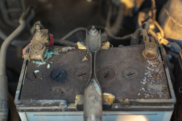 Car battery corrosion .Should be checked in the car service center,Battery terminals corrode, visible in the form of white powder.Terminal corrosion can eventually lead to open electrical connection.