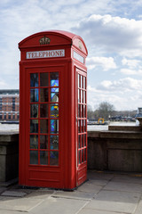 LONDON, UK - MARCH 11 : Traditional Red telephone box with stained glass windows on Victoria Embankment  in London on March 11, 2019