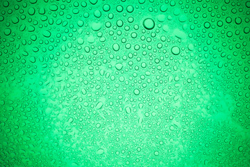 Rain droplets on green glass background, Water drops on glass.