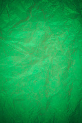 Obraz premium Crumpled green paper recycling background.