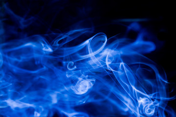Blue toxic fumes movement on a black background.