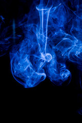Blue toxic fumes movement on a black background.