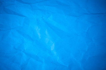 Blue paper crumpled recycle background.