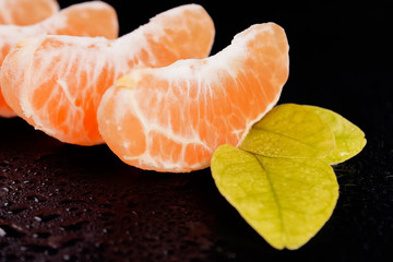 Ripe tangerine helmets with leaves