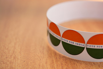 Concept of Indian election, stickers showing vote for better India on table.