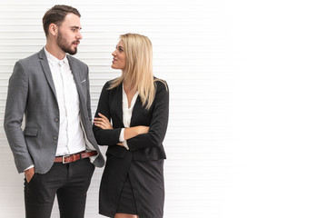 couple business modern people standing talking together with copyspace.