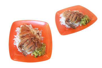 Stewed pork leg on rice in an orange plastic dish, paired with pickled lettuce.isolated on white background with clipping path. Speaking Thailand " khao kha mu ".