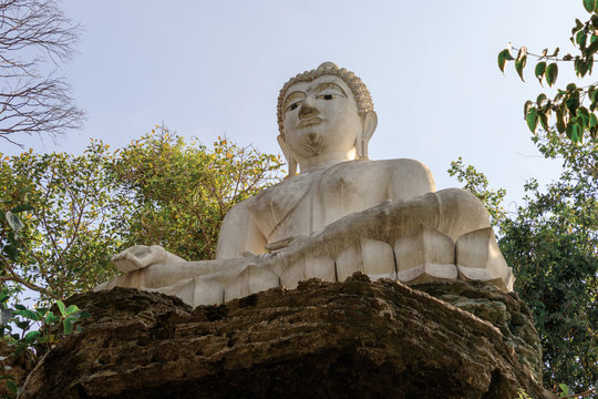 White Buddha Statue on Stone in Temple of Thailand