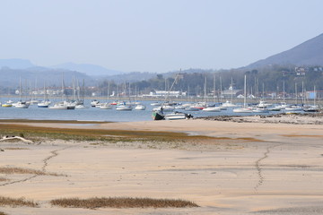 abandoned boats in the port of France in summer at low tide