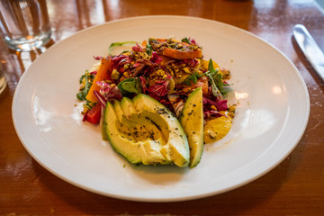 A squash salad with avocado
